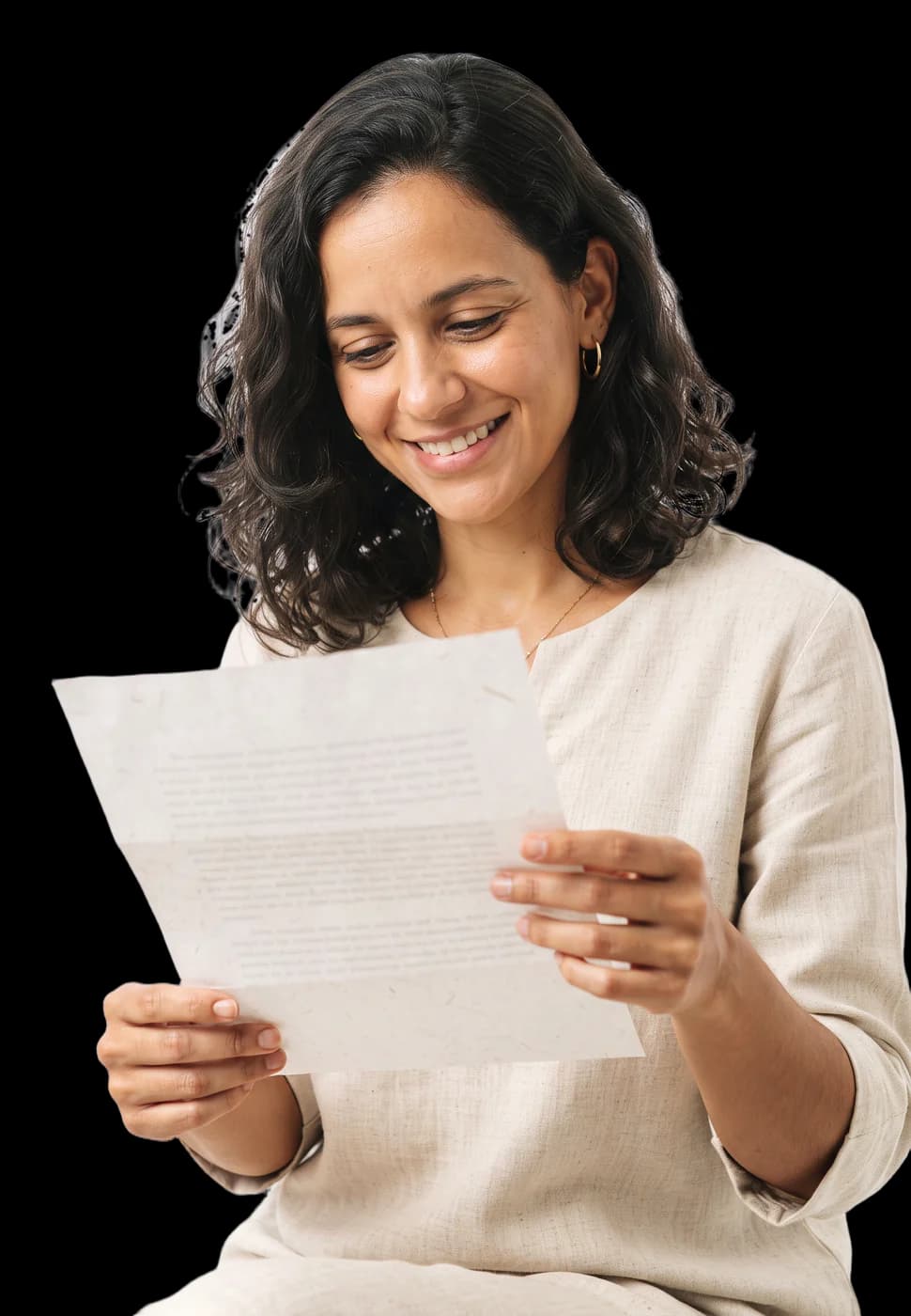 Woman smiling while reading a letter